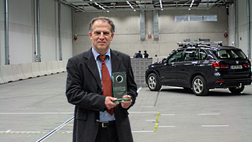 Prof Brandmeier, head of the test centre, in the hall for road tests with prize